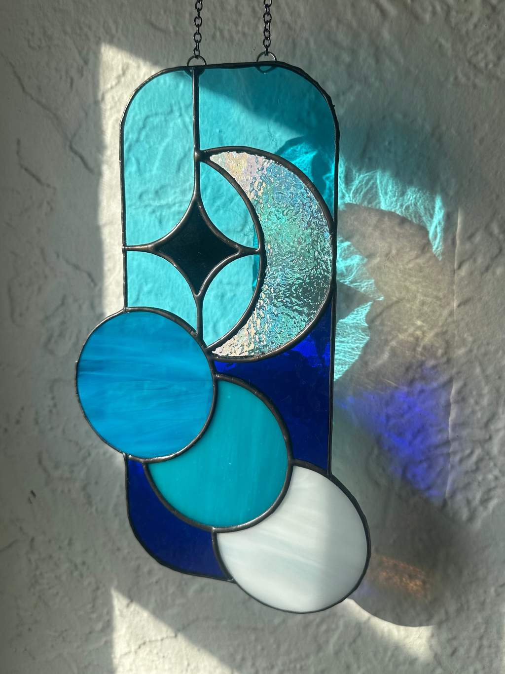 Stained glass panel near a window